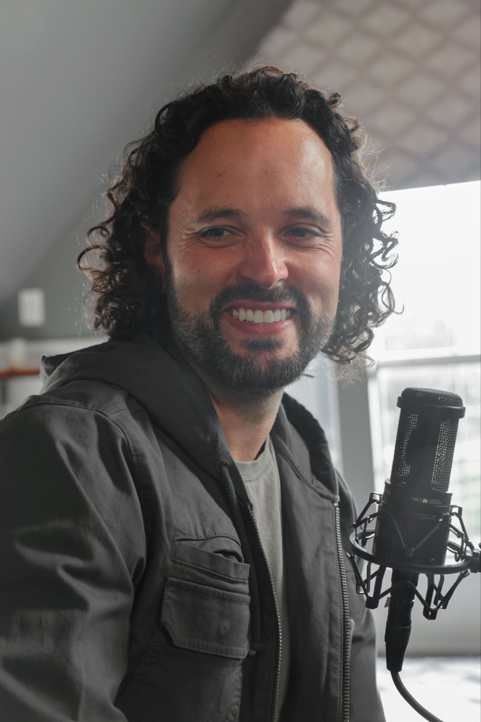 Men's Marriage Coach Angelo Santiago recording an episode of Better Husband Podcsast