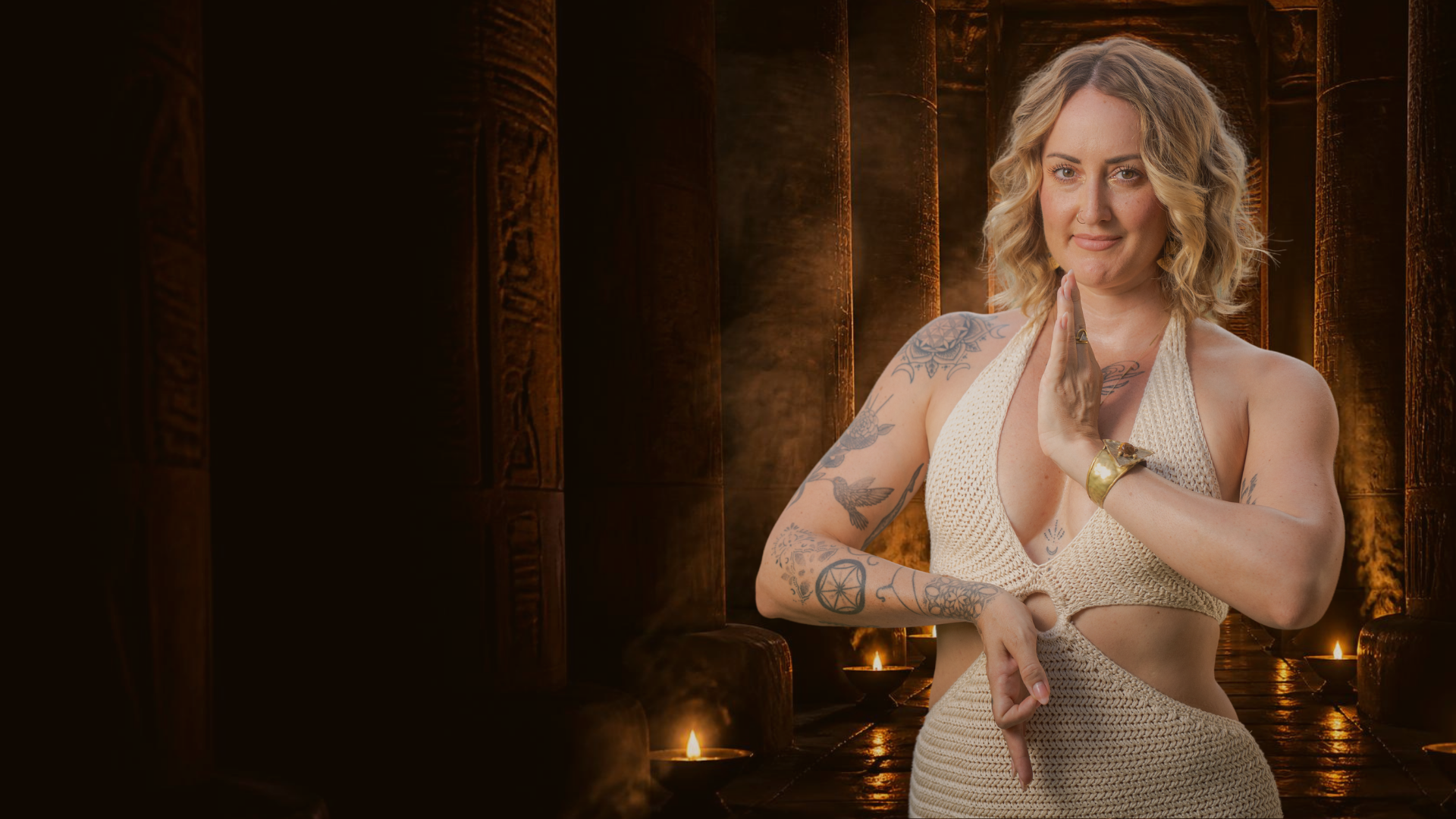 Nixie Marie standing in a candlelit Egyptian temple