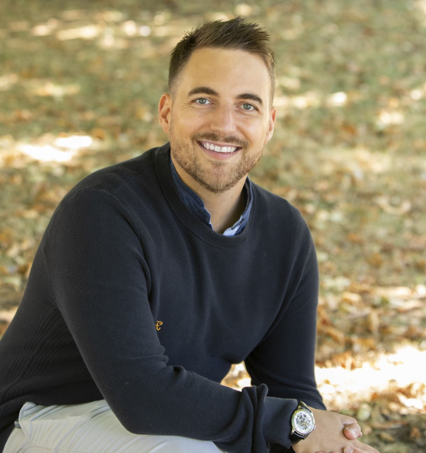 Description: Franck Brown sat outside smiling