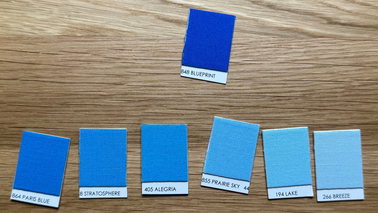 seven color chips in blue arranged from darkest to lightest