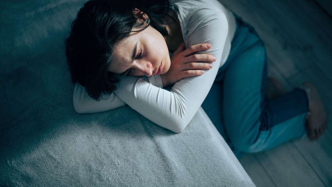 Teen struggling with motivation and isolation while parent worries nearby