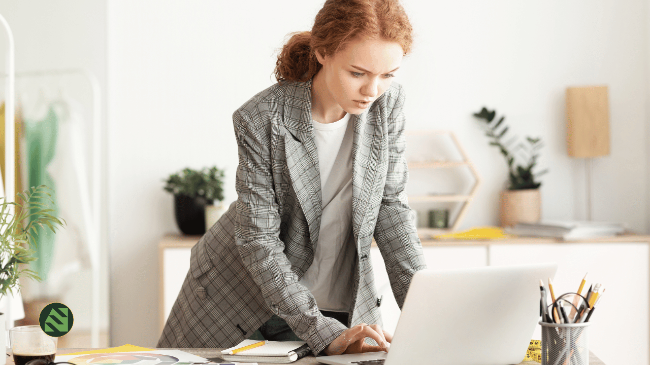Entrepreneur hesitating over the “Publish” button on a laptop