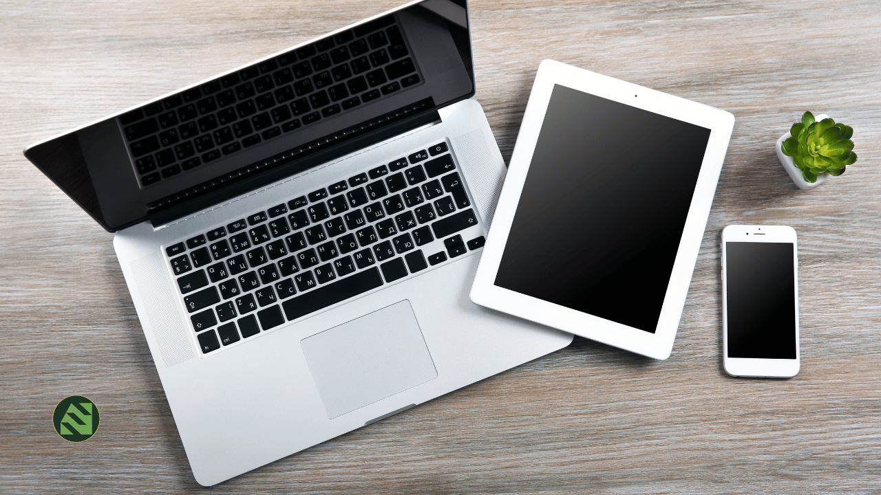 laptop with tablet and phone