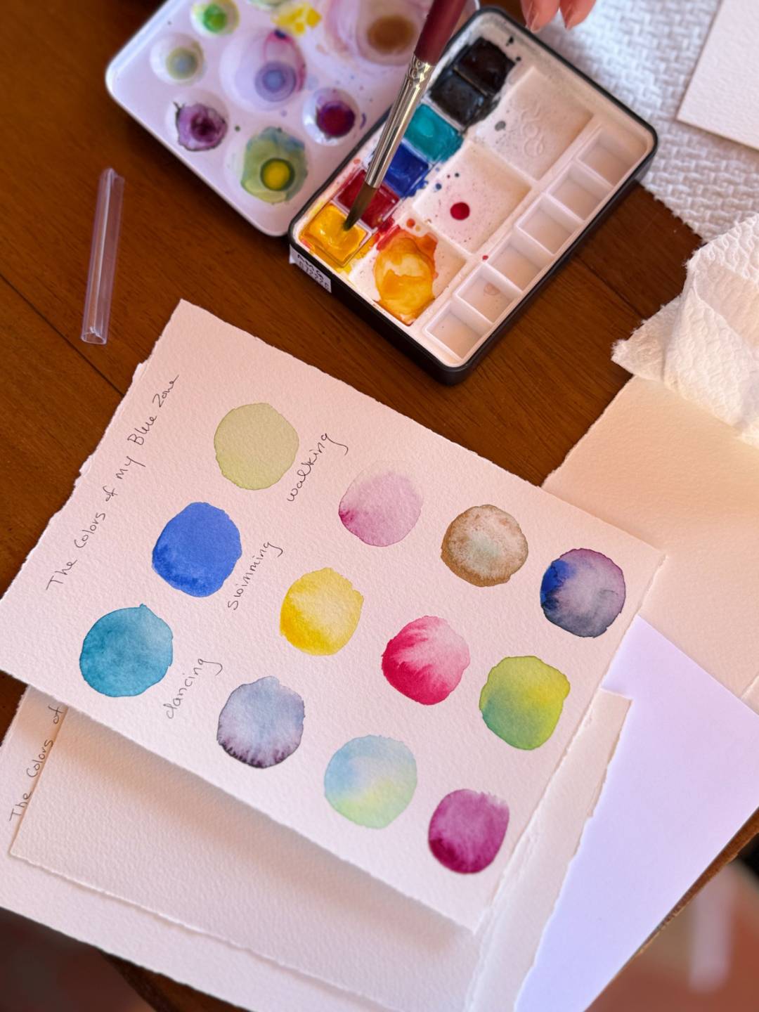 Watercolor palette and painted color swatches