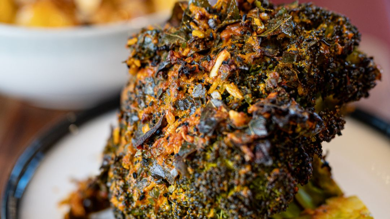 Oven-roasted broccoli covered in a spice marinade and then a spiced yogurt for a crunchy outer texture. 