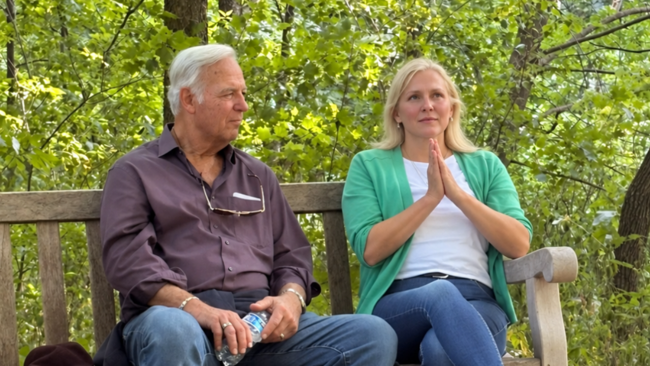 Jack Canfield  and Sarah McCalden sitting on a bench in the Arboretum in Minneapolis