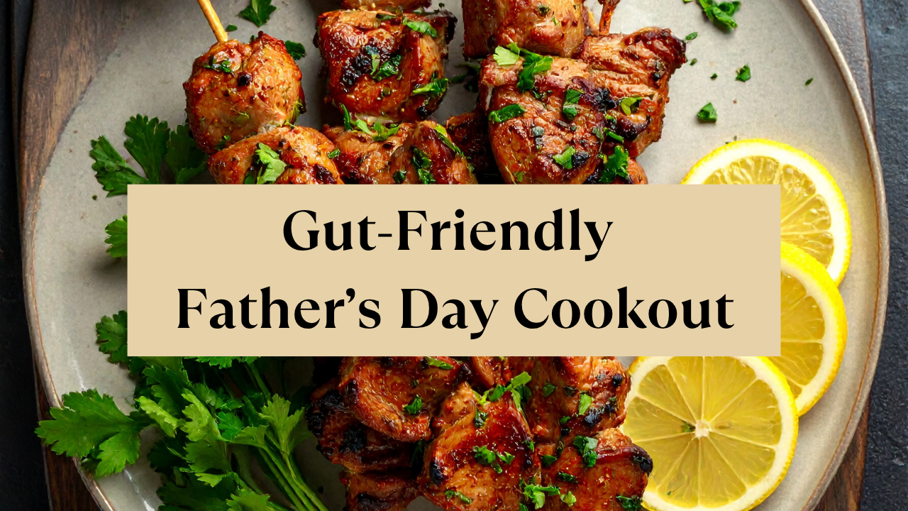 Chicken skewers on the grill with sliced lemon as garnish with the overlay text "Gut-Friendly Father's Day Cookout"