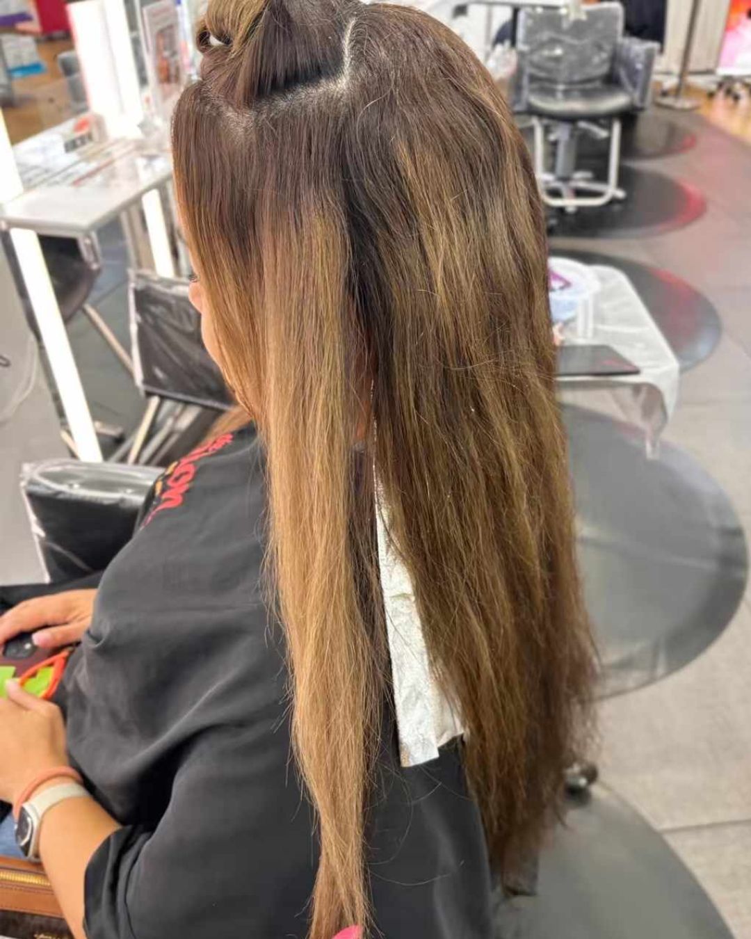 Before: long brunette hair with grown-out color