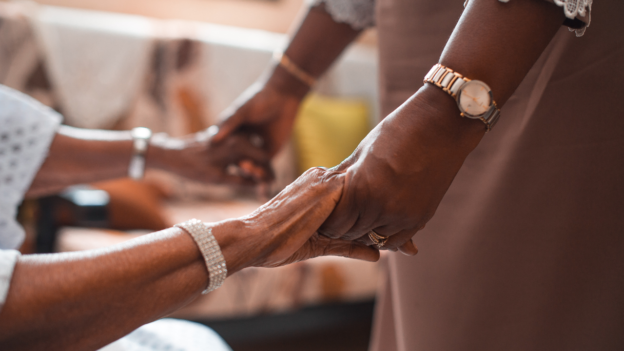 Healthcare leader listening to a caregiver, representing empathy in healthcare leadership