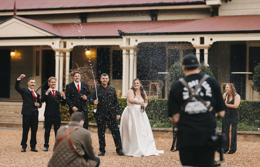 Josh shooting a wedding party celebration outside a homestead