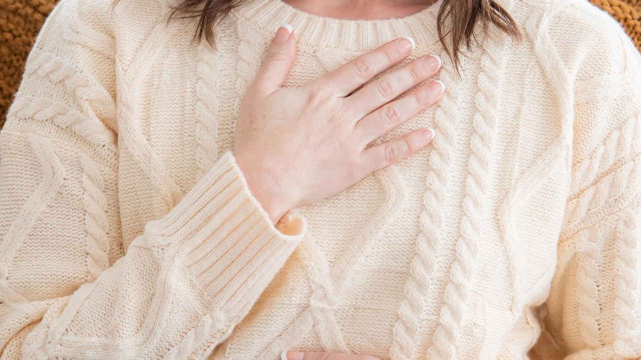 Woman practicing mindfulness with her hand on her chest