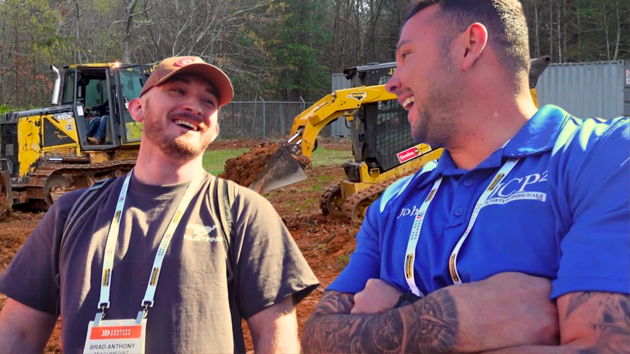 John Seaman and Brad Anthony with Bull Dozer and Skid Steer in background.