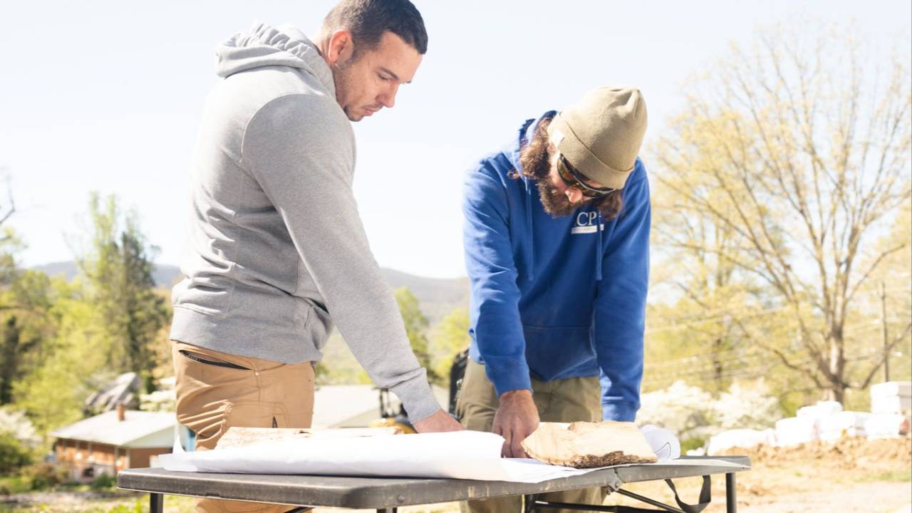 John Seaman looking at Blueprints with Crew Lead