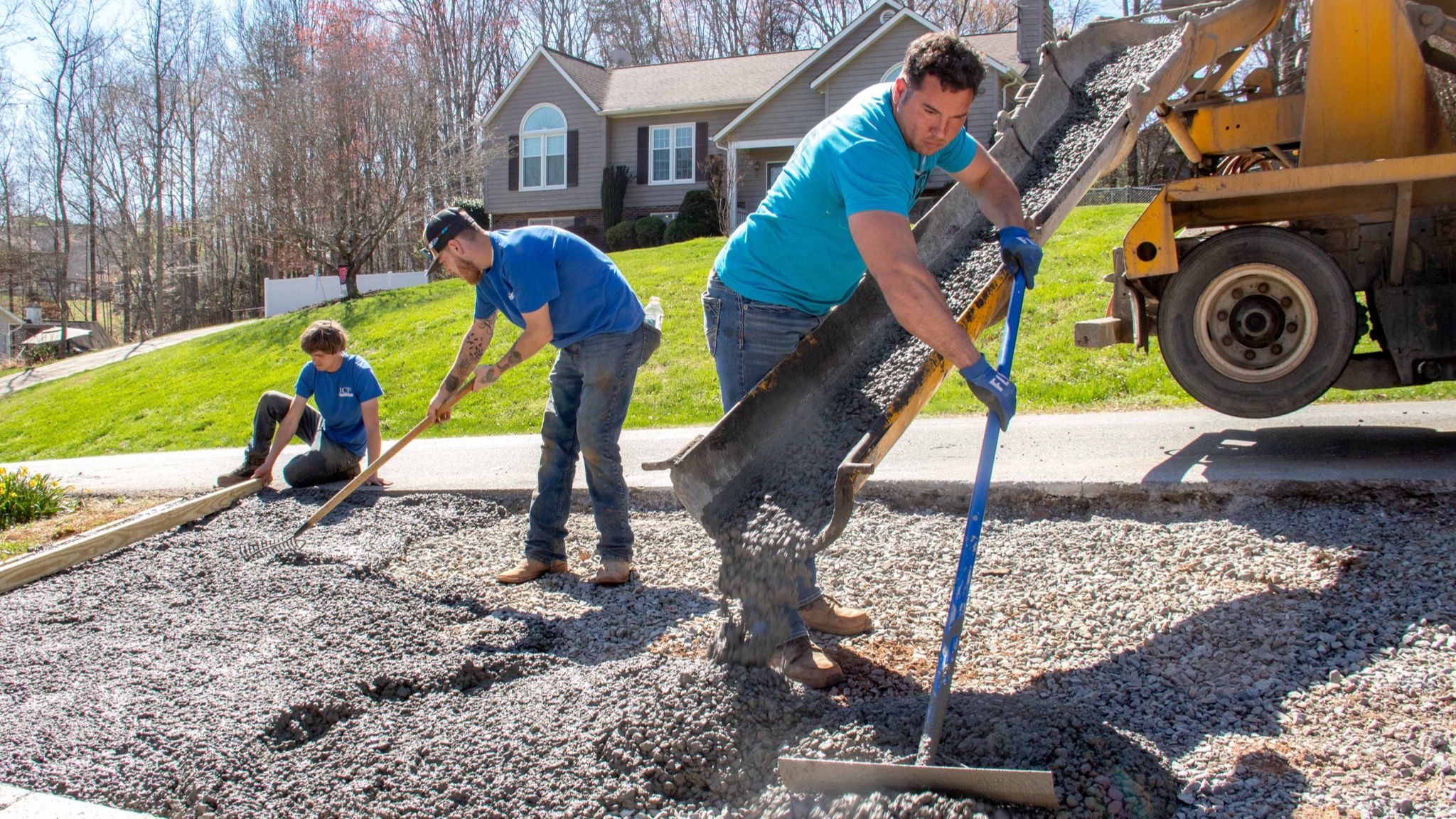 John Seaman and Crew pouring concrete driveway from concrete truck