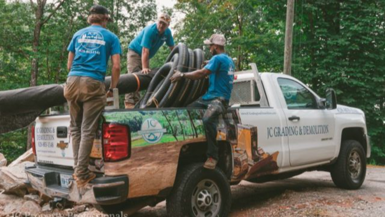 JC Property Professionals crew with work truck.