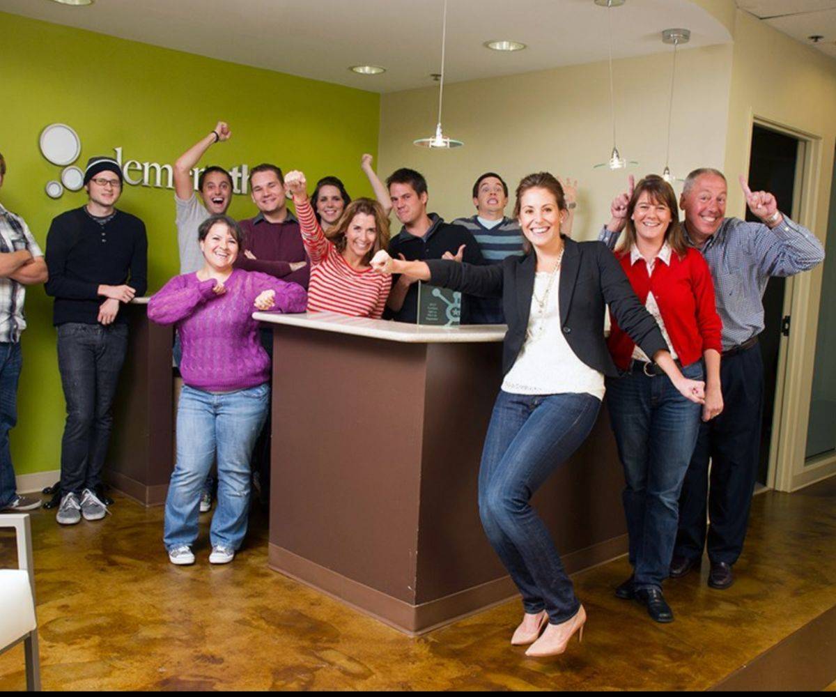 Tiffany celebrating with the early Element Three team in the office lobby.