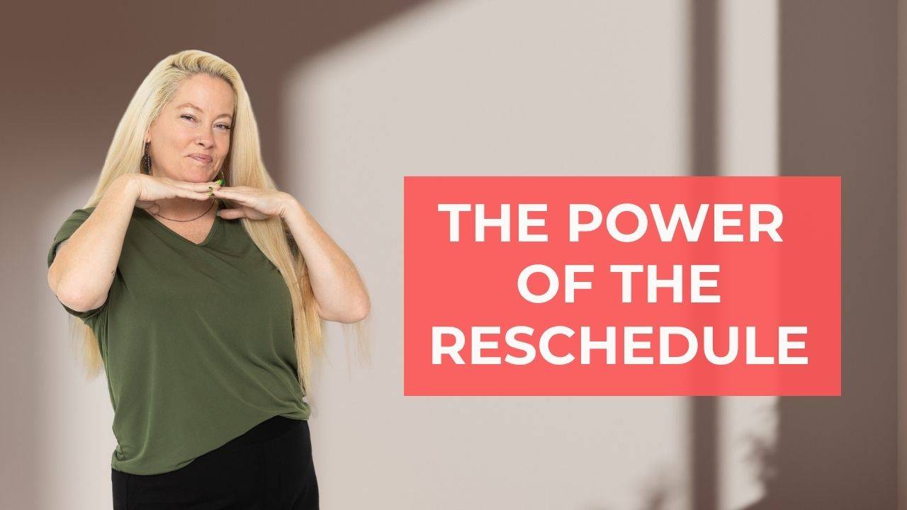 blonde woman in olive green shirt with black pants smiling and her hands under her chin with words on the screen that say, "The Power of the Reschedule"
