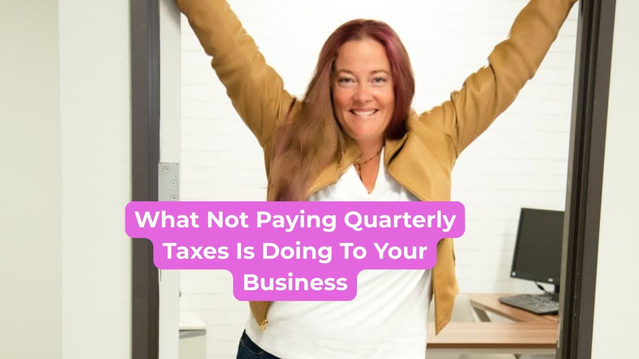Woman wearing a beige leather jacket hanging her arms on the door frame smiling with words on the screen that say, "What not paying quarterly taxes is doing to your business" 