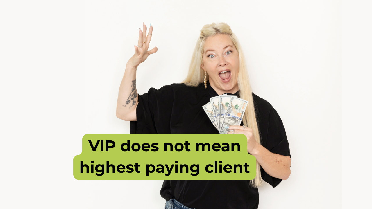 Woman standing in black shirt holding money and a happy surprised face