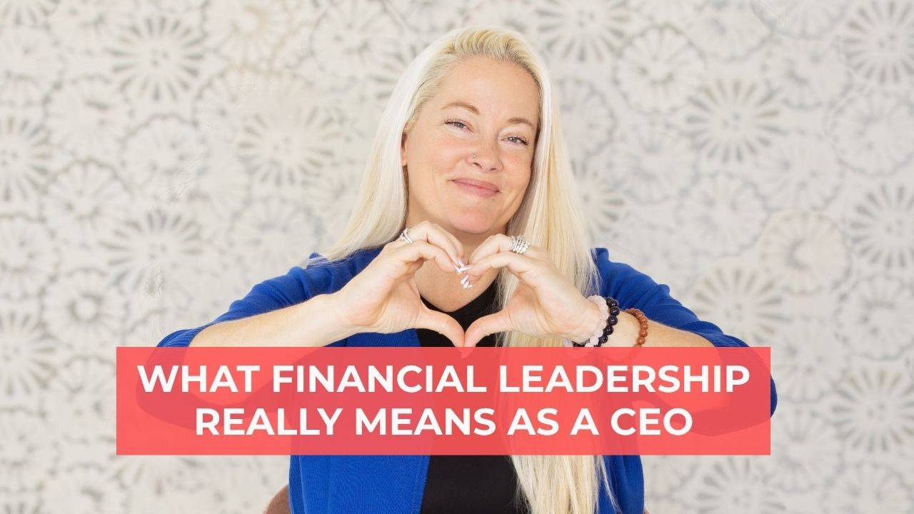 Woman with blonde hair wearing a black shirt and blue cardigan smiling and making a heart shape with her hands and words on the screen that say, "What Financial Leadership Really Means as a CEO"