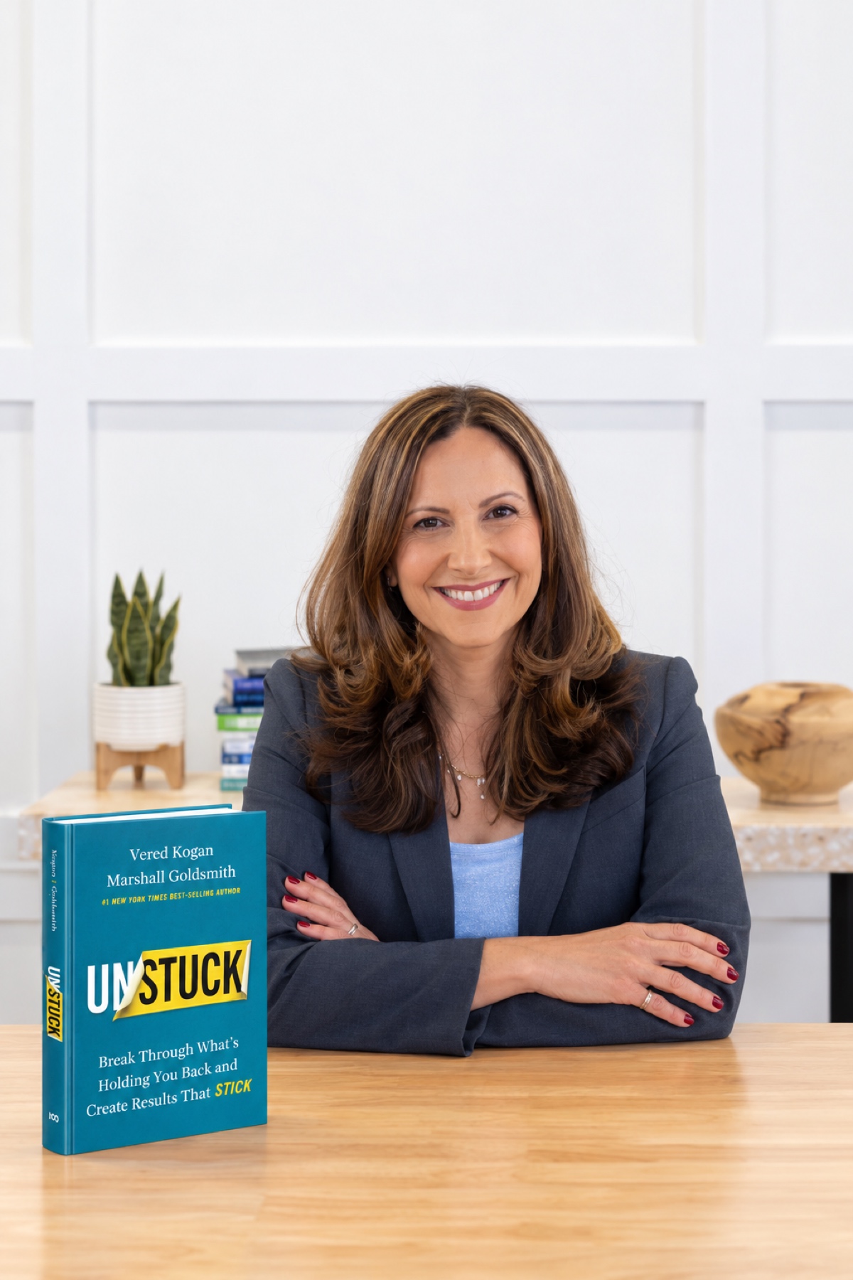Vered Kogan seated with her book UNSTUCK