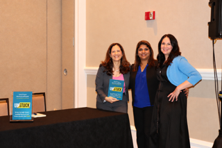 Vered Kogan posing with friends and an UNSTUCK book at Change Orlando