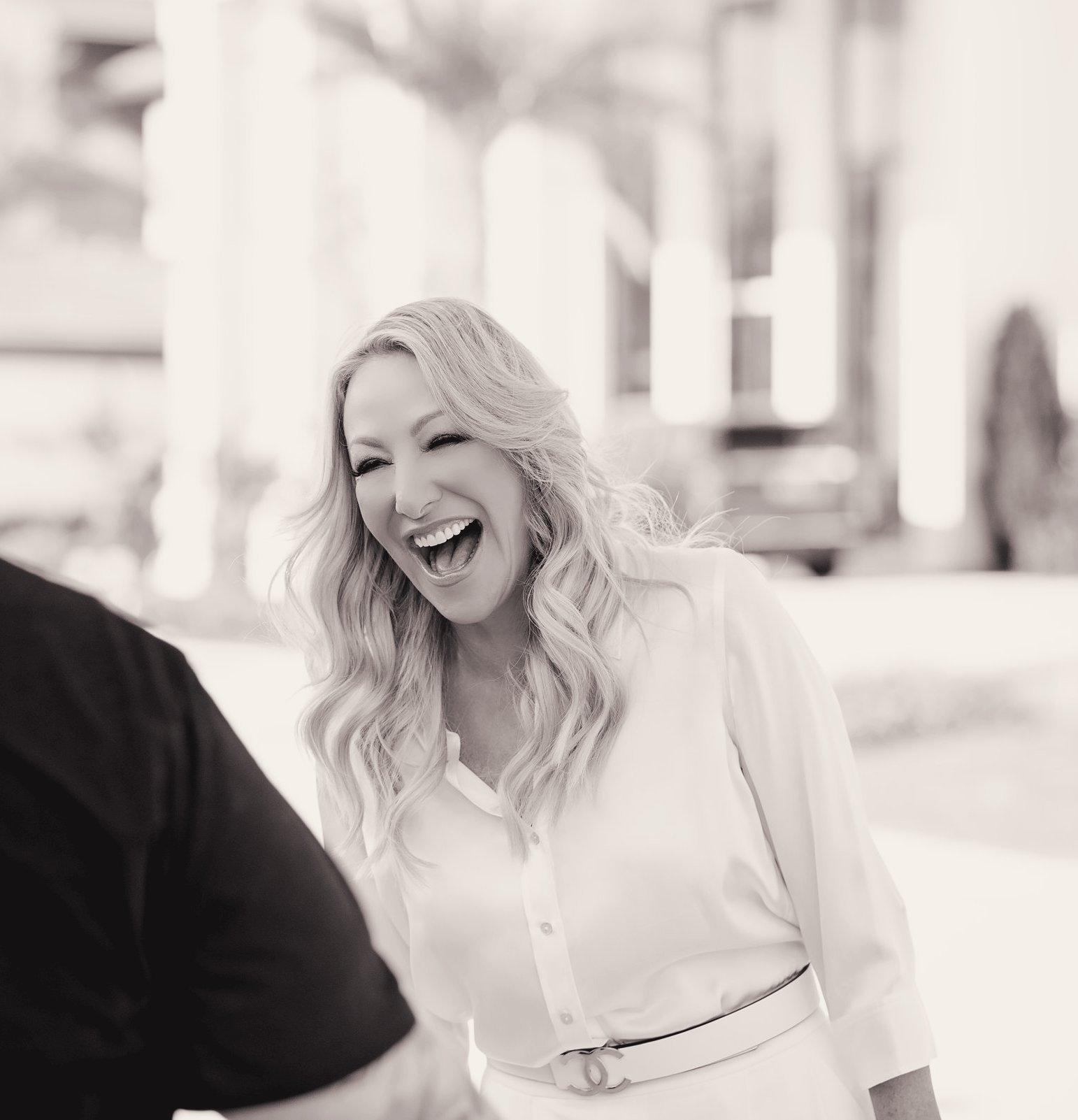 Brooke Hicks laughing in conversation