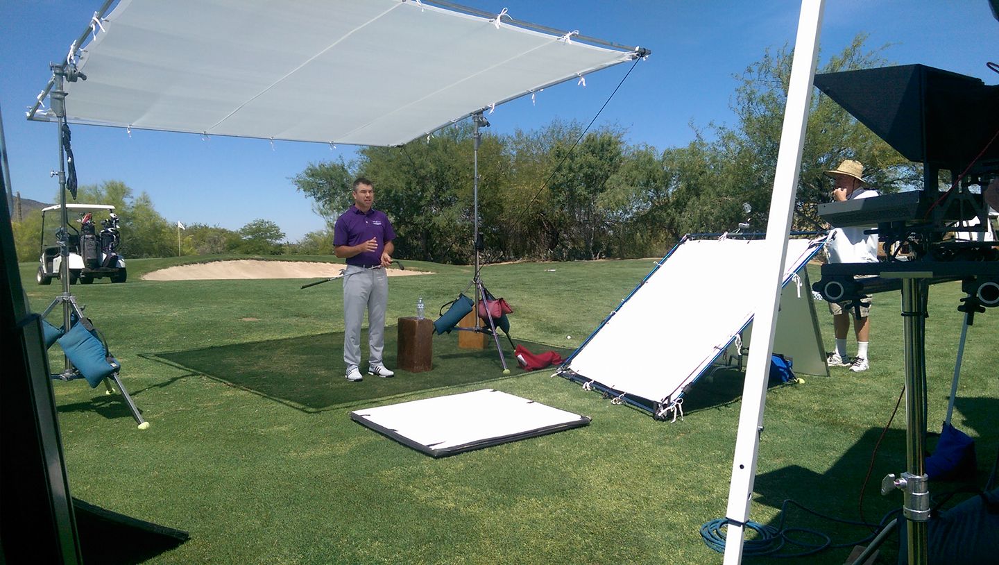 Golf-course production using a large diffusion frame and reflectors for a wider outdoor shot