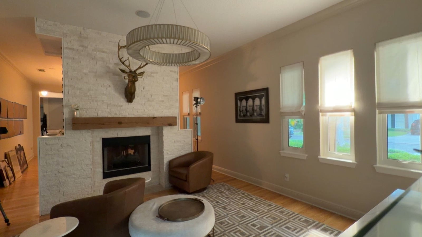 Hard light entering through the middle window and creating shape across the room