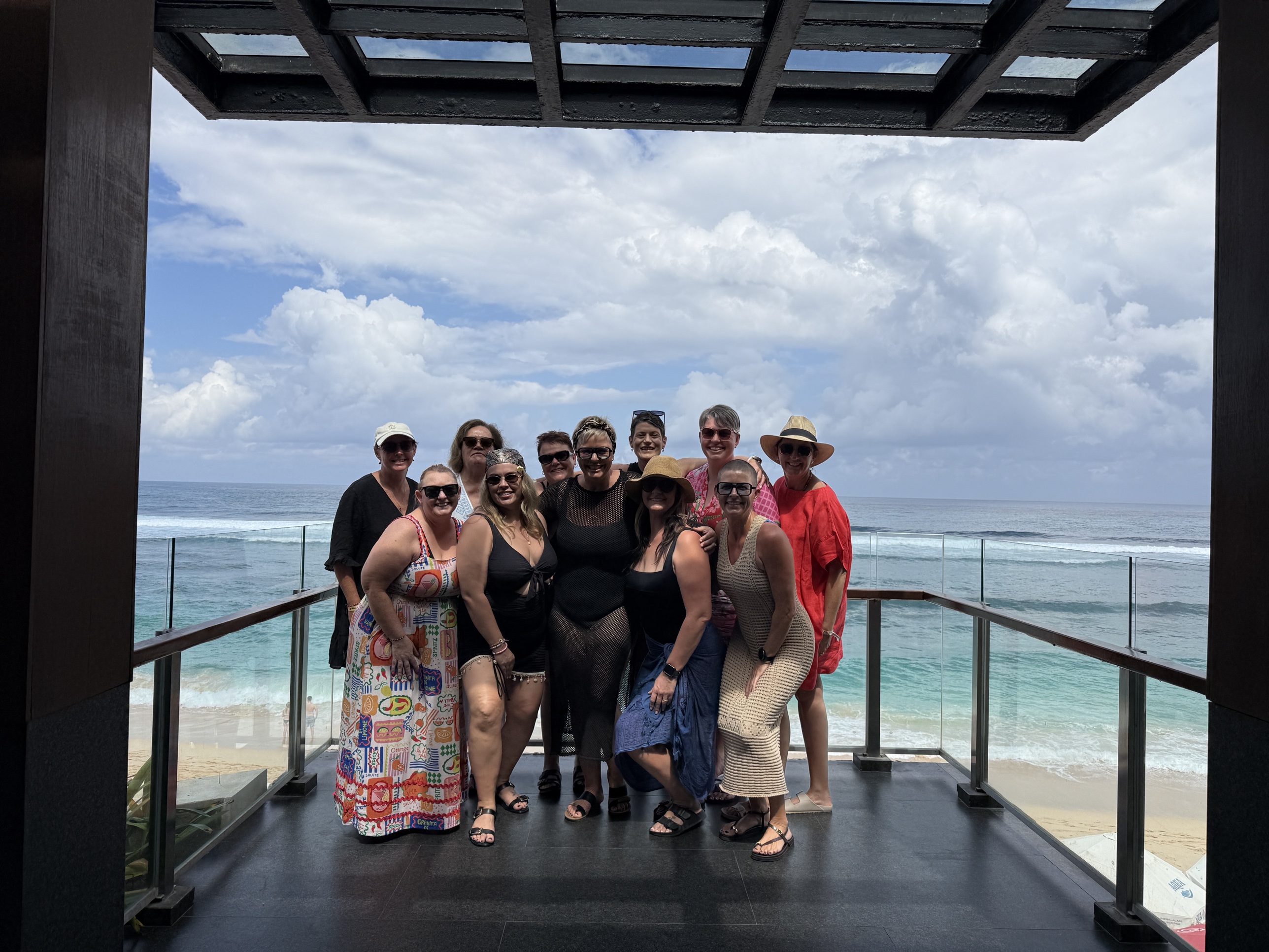 Group of women on an ocean-view deck at RECHARGE Bali retreat