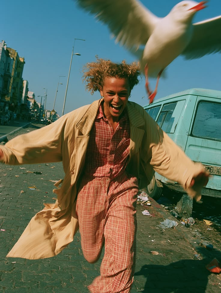 Woman dancing joyfully in the street