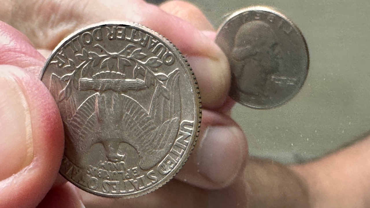 Image of both sides of a quarter as they appear in a mirror. An upside-down eagle is on the front of the coin. George Washington is upright in the mirror version