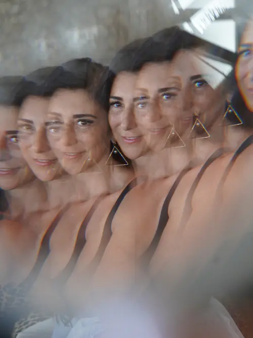 Dina seen through a prism, with multiple overlapping reflections.