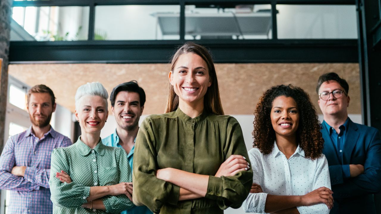 A confident woman communicating clearly as a leader in a professional meeting