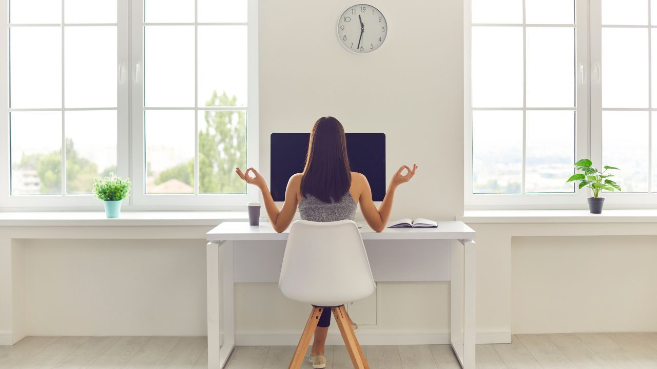 A composed woman in a professional setting virtually, representing staying calm and responding confidently to microaggressions at work