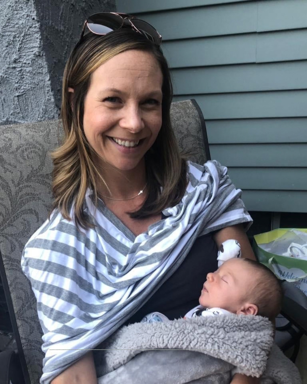 Angela newly postpartum holding her baby