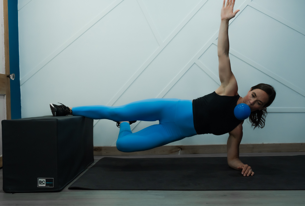 Angela using a ball during advanced core training