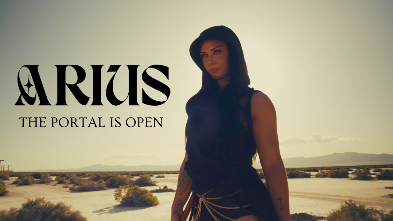  Woman in a black hooded fantasy-inspired outfit standing in a golden desert landscape, representing the immersive movement and fantasy training experience of Arius.