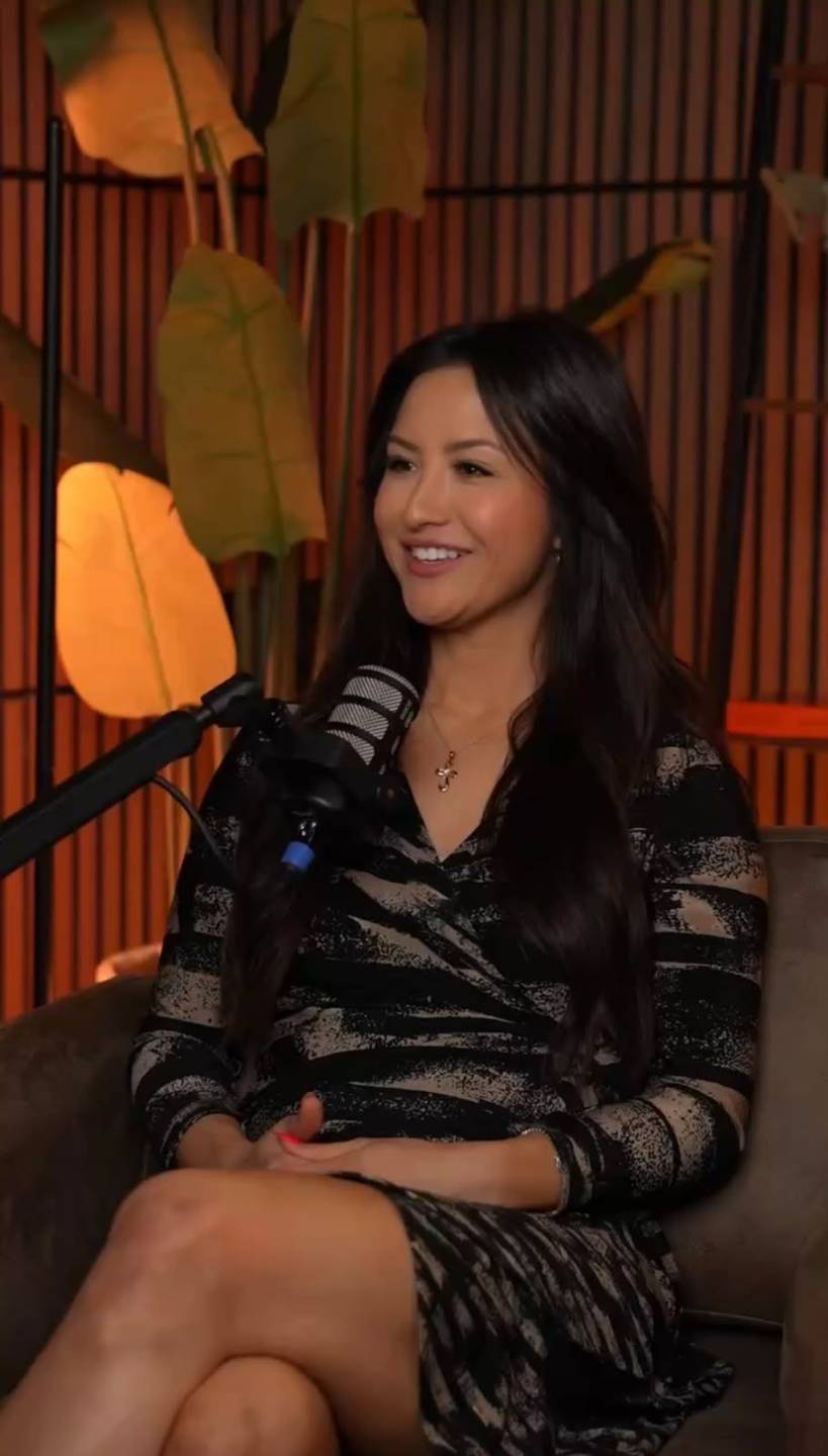Ellie seated during a podcast conversation