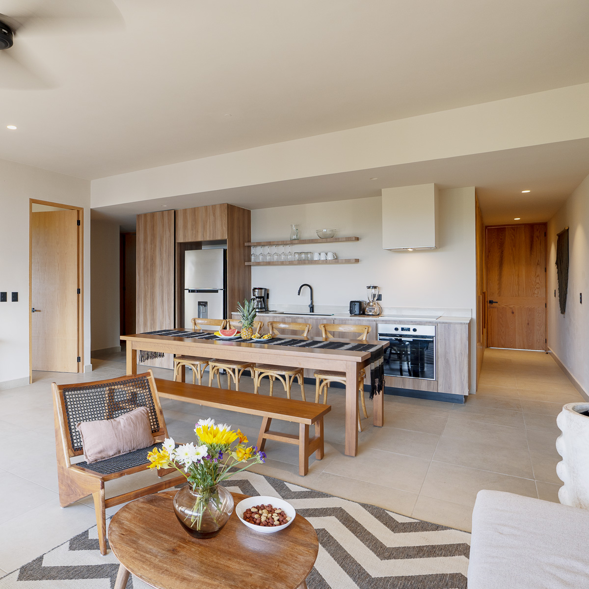 Living room, dining table and kitchen at the Urban Temple