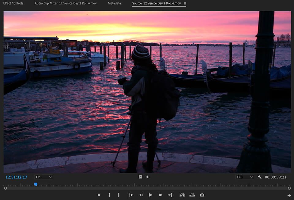 Filmmaker capturing a stunning sunset by the waterfront, included in the Pro Level Raw Footage from Inside The Edit
