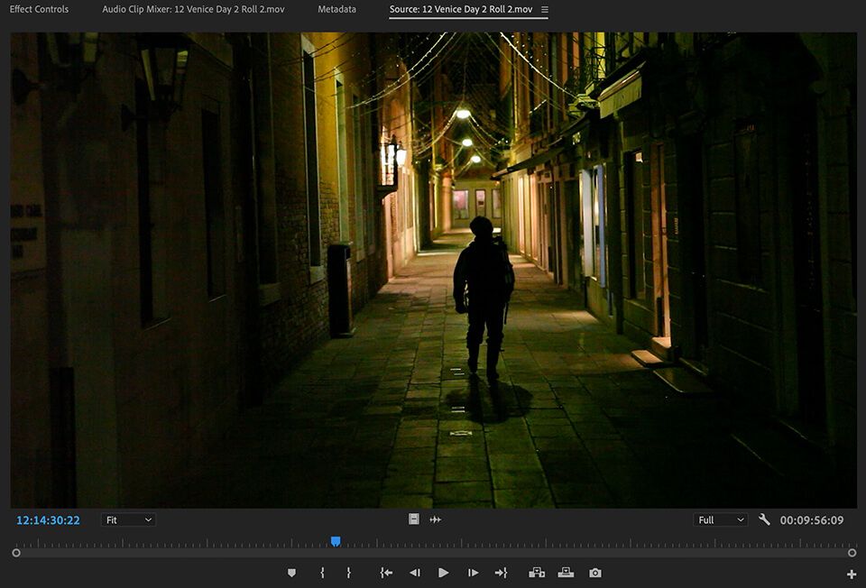 Filmmaker capturing a dramatic moment in a dimly lit alleyway, part of the Pro Level Raw Footage for Inside The Edit members.