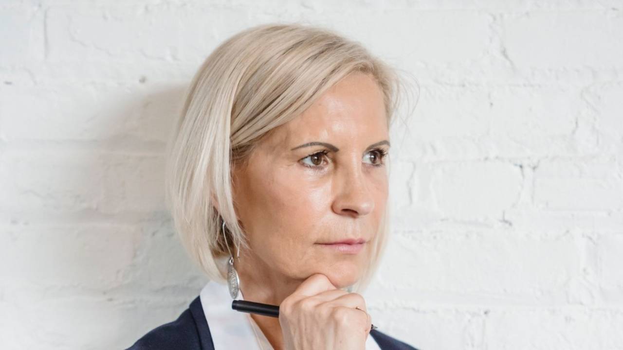 Thoughtful licensed therapist considering her IFS training options while waiting on Level 1