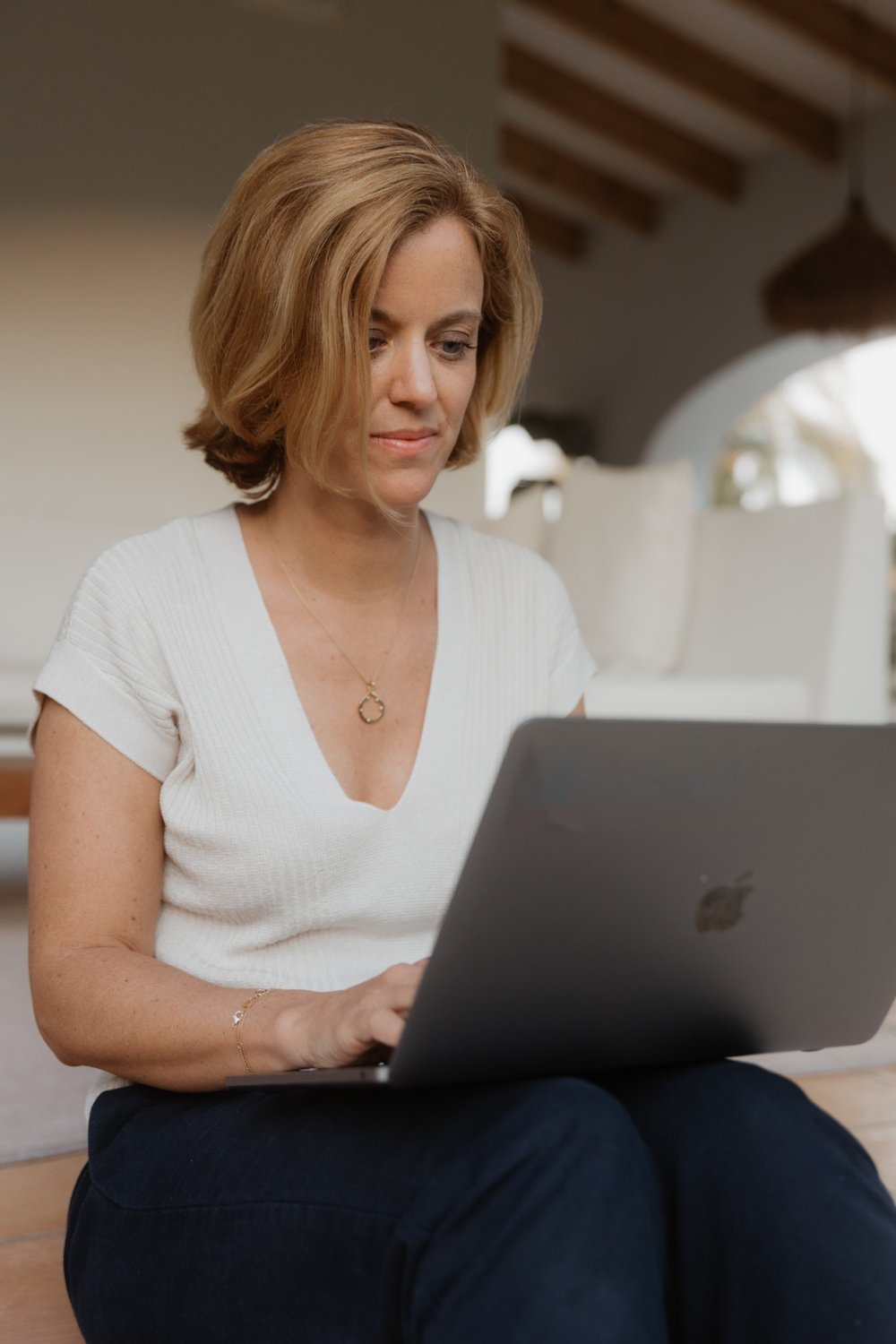 Elena working on her laptop