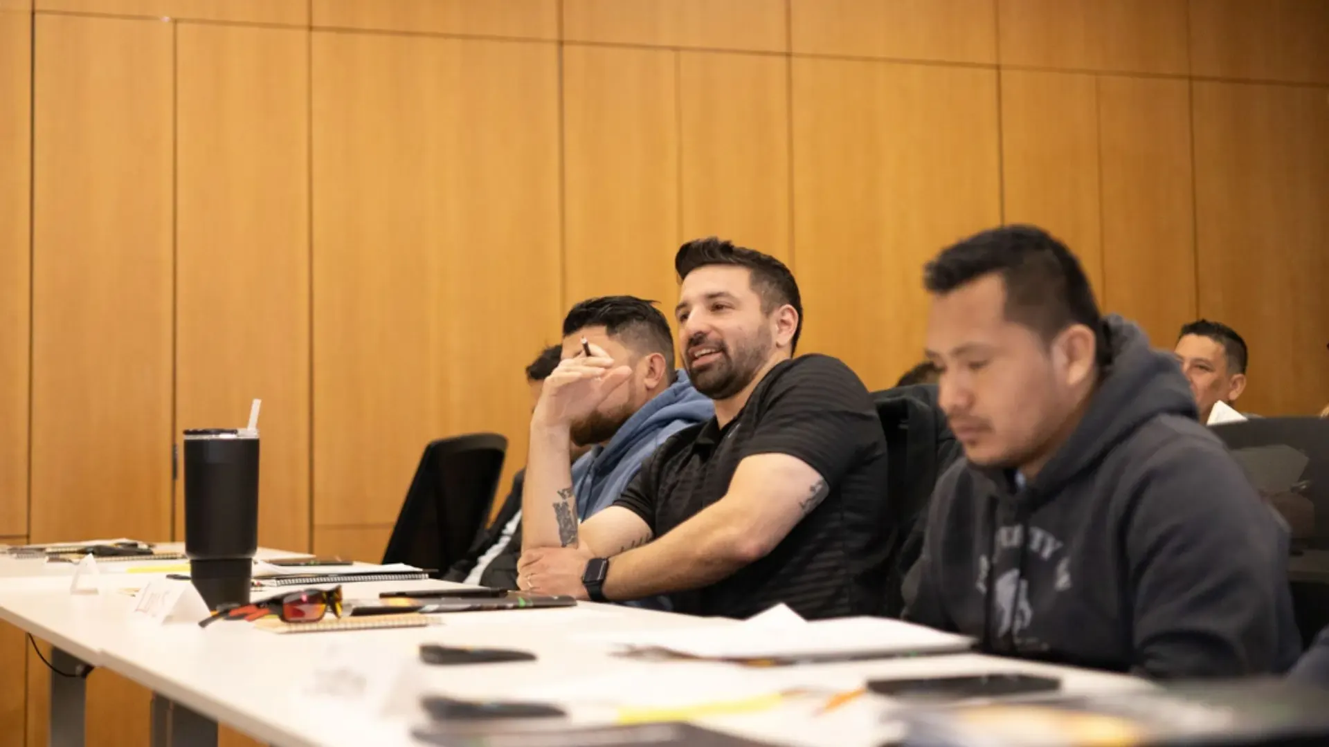 A multilingual roofing class with English and Spanish speaking students at the Illinois Roofing Institute