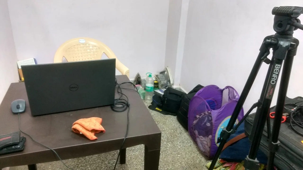 His first studio in 2016: a small room in Mumbai with a laptop on a plastic table, a plastic chair and a tripod