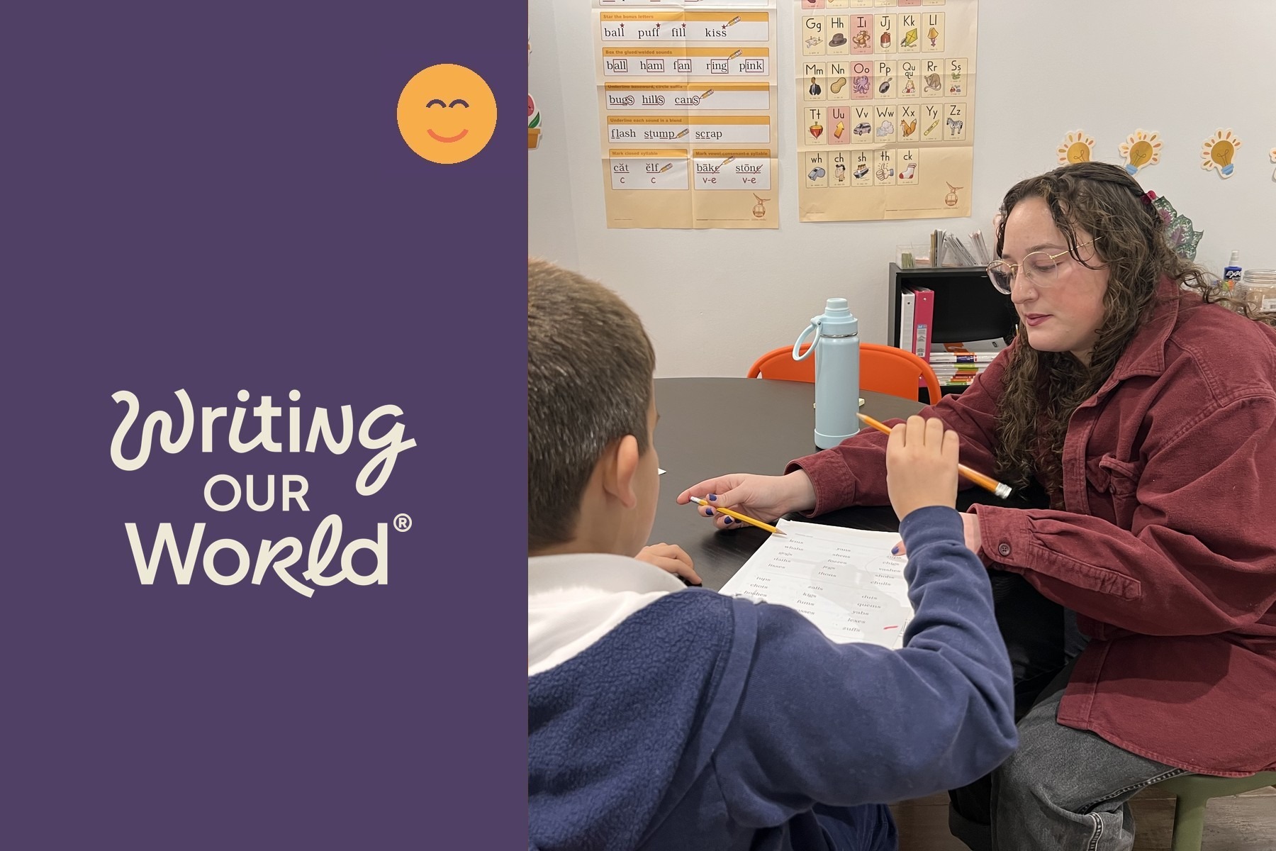 Teacher guiding a student through a 15 minute writing lesson at a classroom table