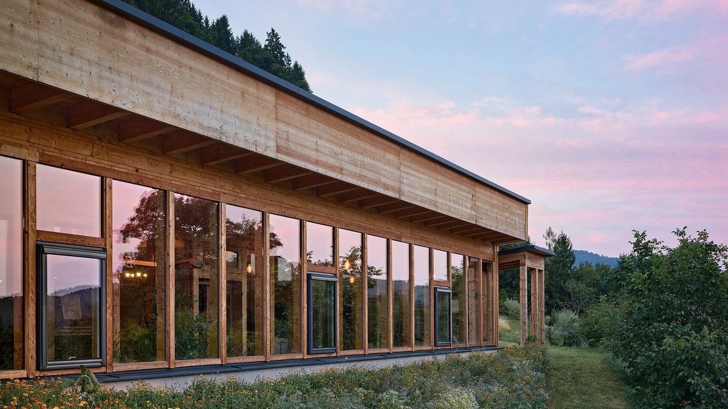 An off-grid family home in Austria at dusk