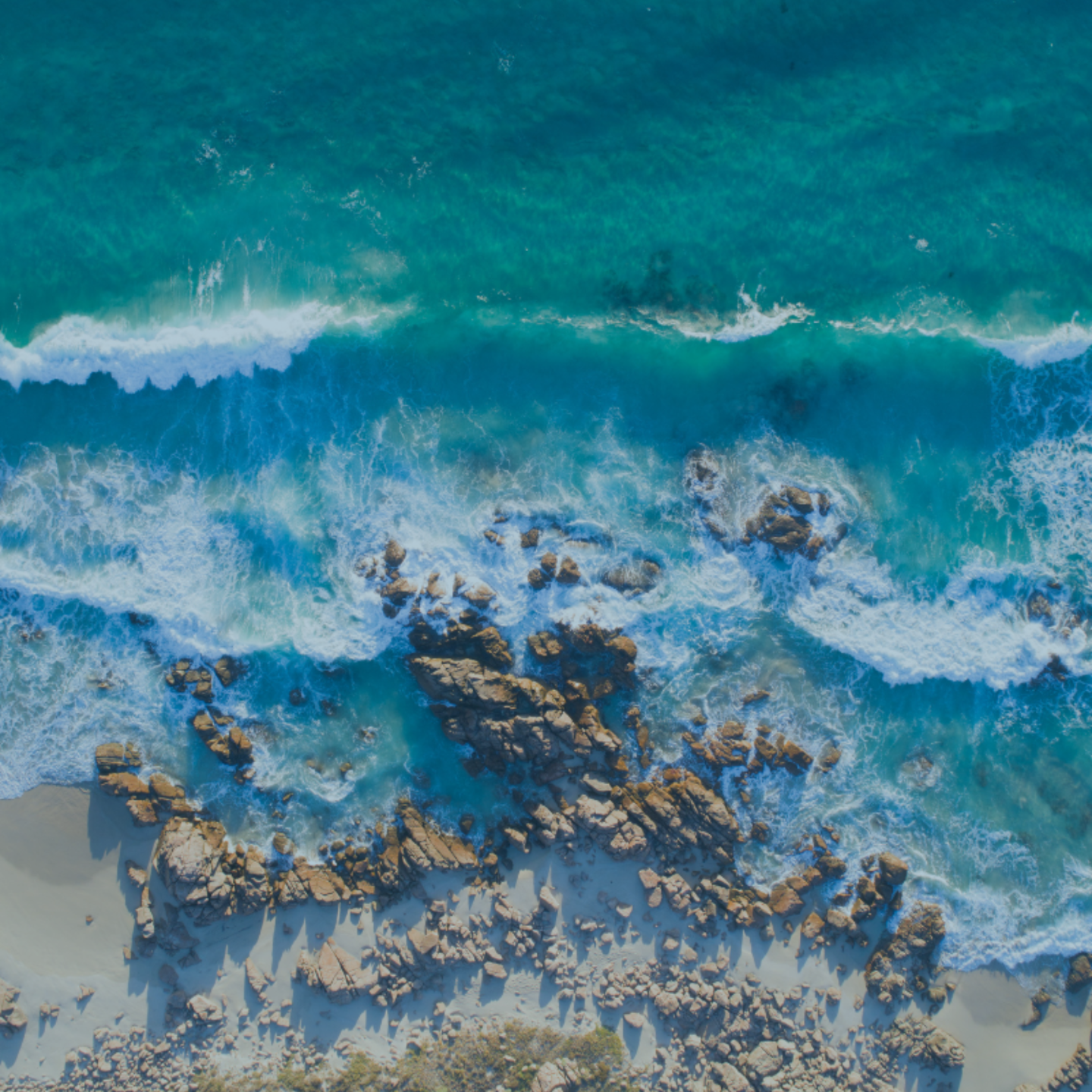 Aerial view of waves breaking along the Western Australian coastline