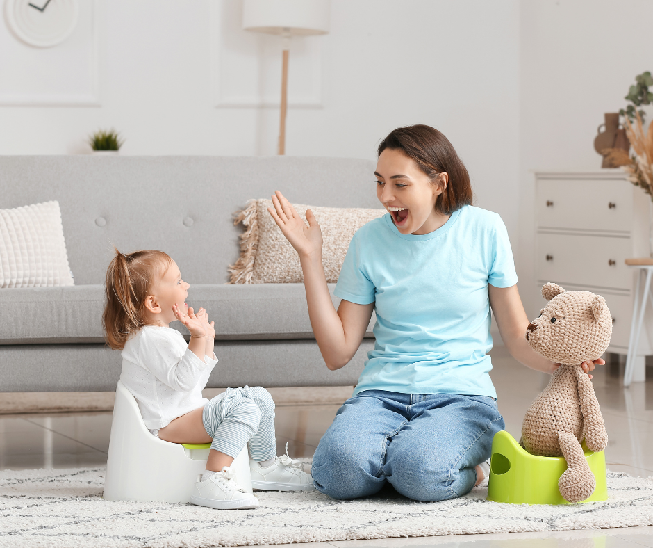 Mum with a toddler sat on the potty